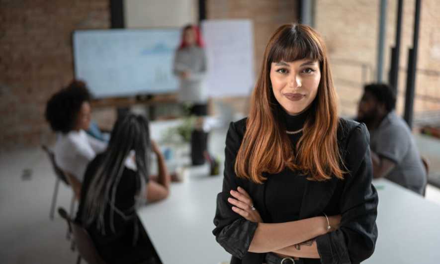 small business owner helping team to create benefits package