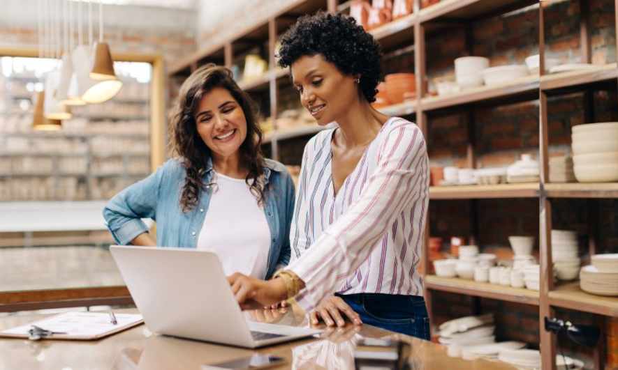 small business owner using technology to manage business