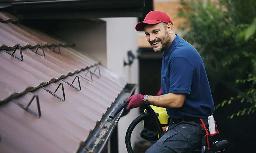 business owner protected by gutter cleaning insurance