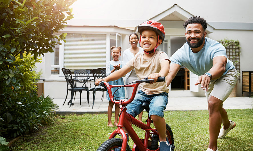dad and son riding bike