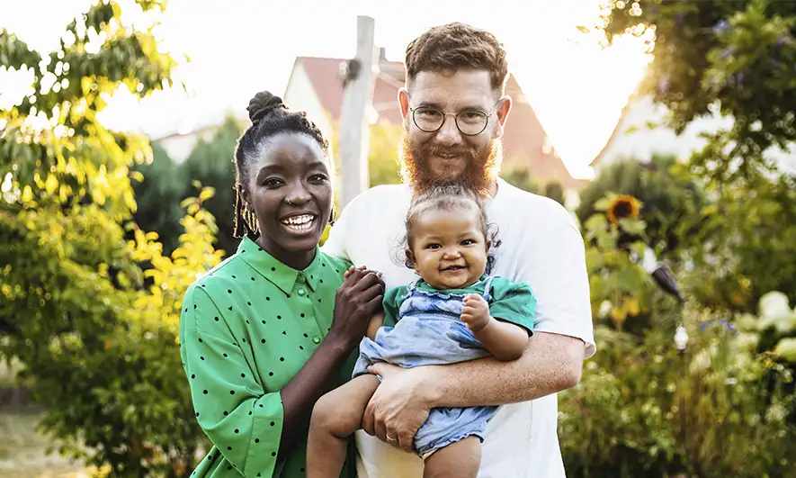 mom dad child in woods