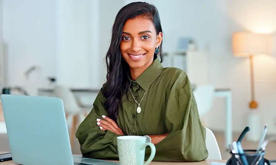 Woman in business attire smiles