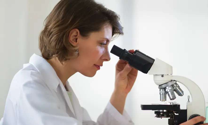 A woman standing in a lab