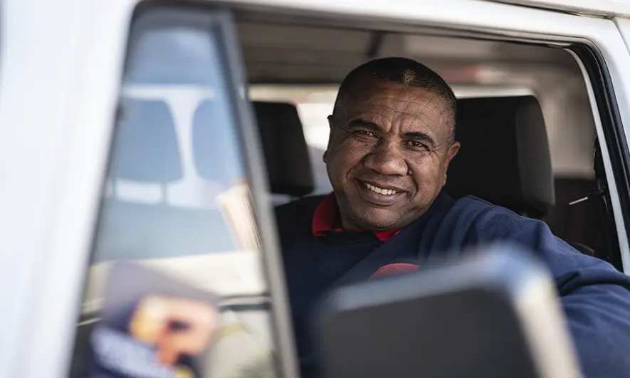 Man behind the wheel of a car