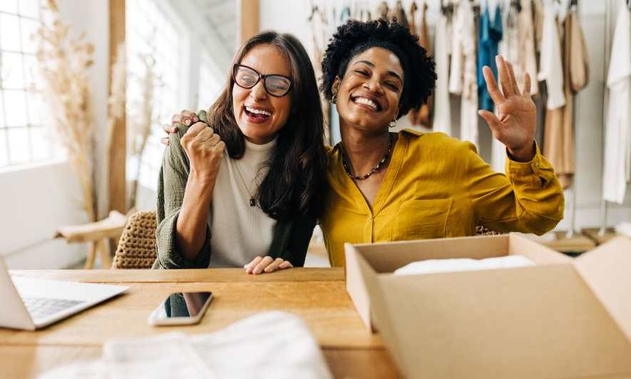 small business owners celebrating success