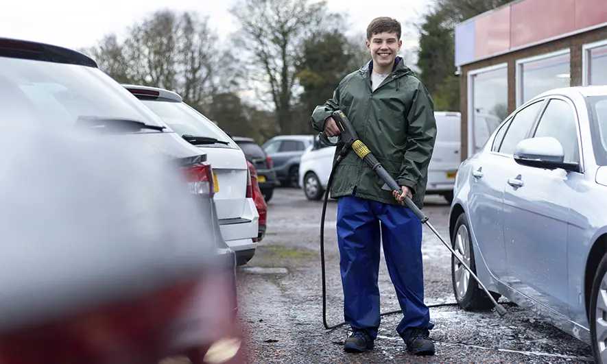 business owner protected by pressure washing business insurance