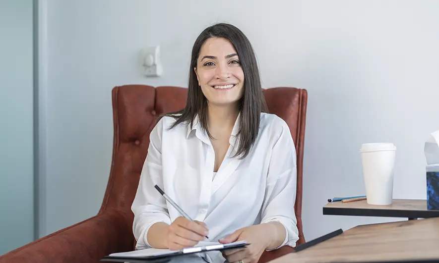 female business owner protected by psychologist liability insurance