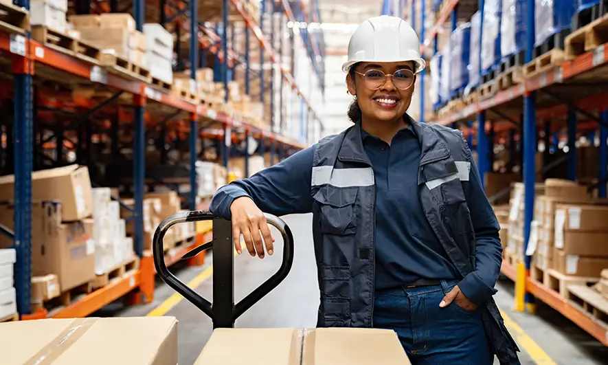 Warehouse worker wears a hard hat