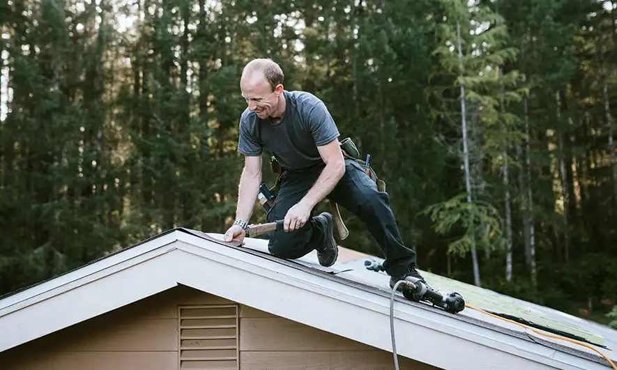 male business owner protected by roofing insurance