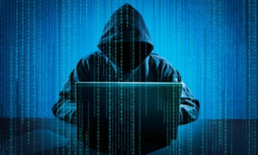 Hacker using laptop. Hacking the Internet.