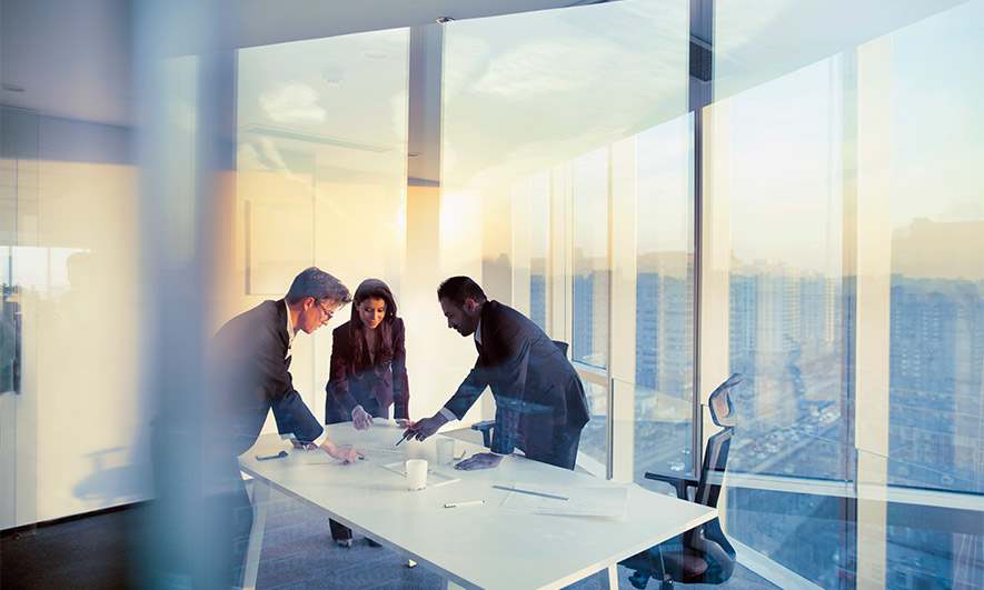 Three business collaborators working together