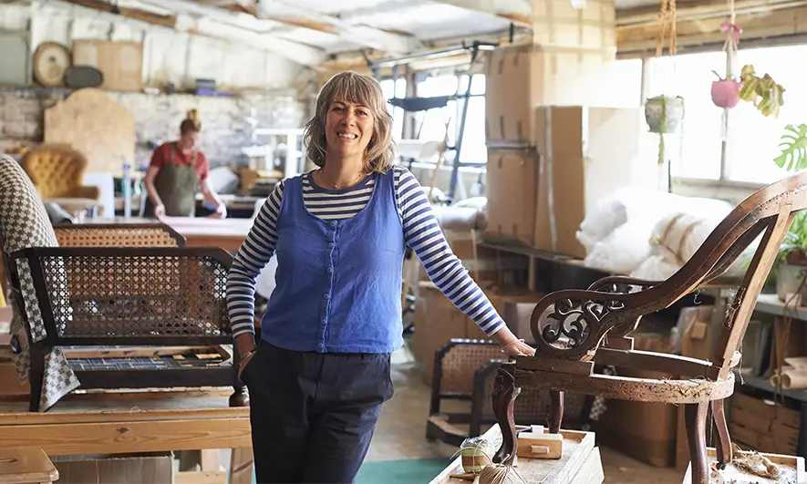 female business owner protected by upholsterers insurance