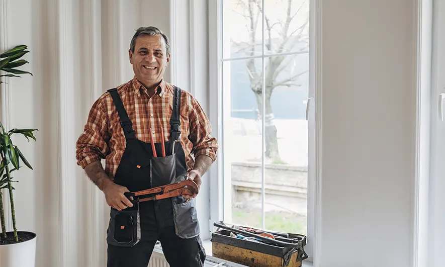 male business owner protected by window installation insurance