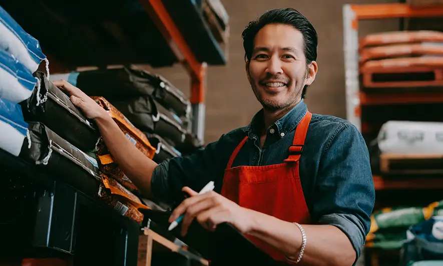 small business owner happy with the best business insurance