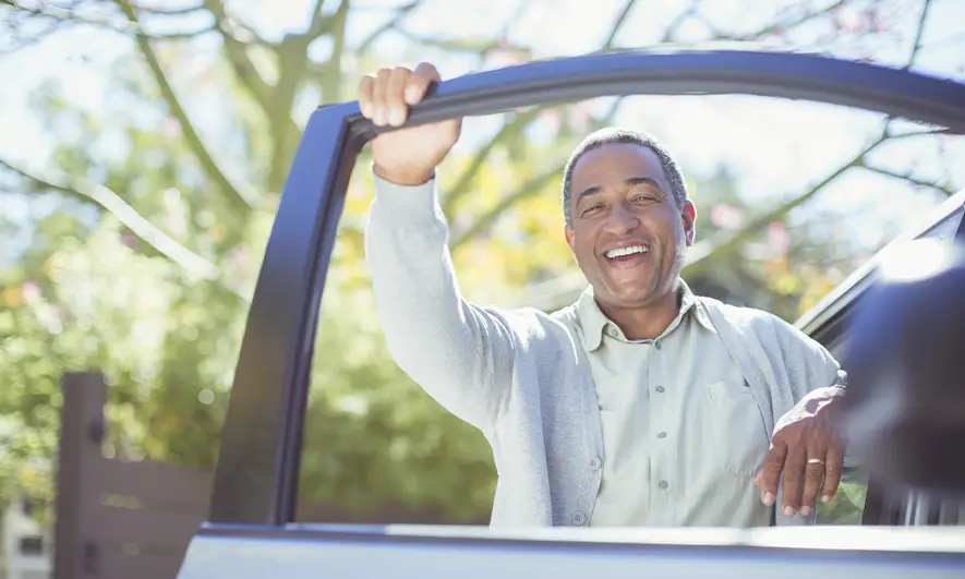 man pleased with AARP Membership Benefits from The Hartford