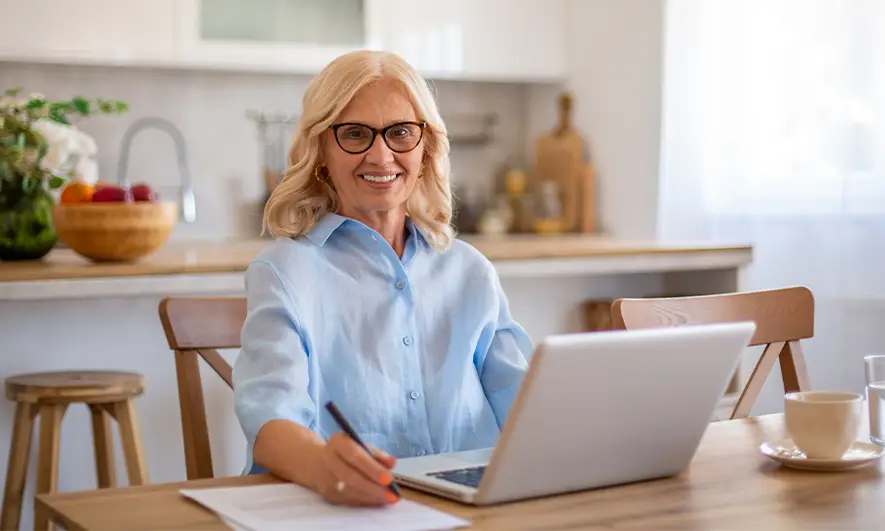 Woman pleased because she understands auto insurance declaration page