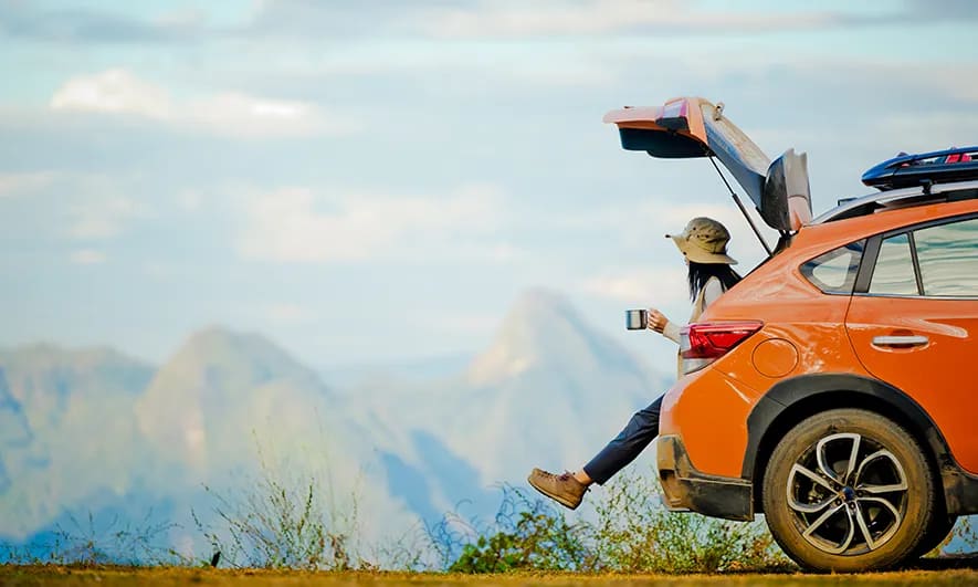 woman happy to have full coverage car insurance