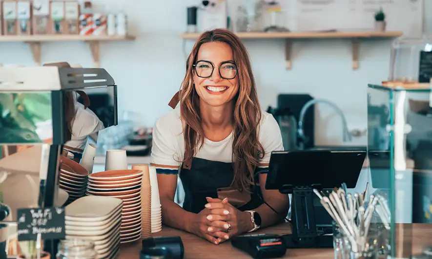 small business owner happy to understand general liability insurance cost