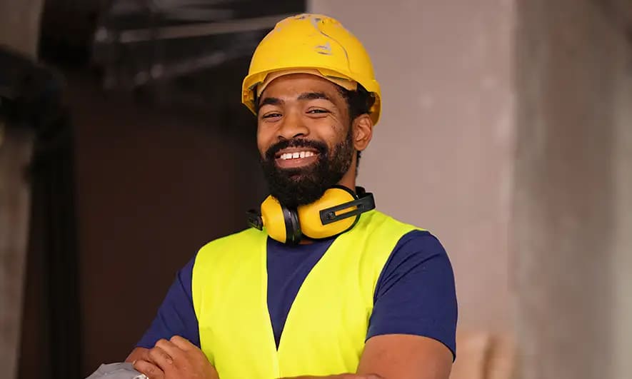 small business owner feeling happy to be protected by General Liability Insurance for Contractors