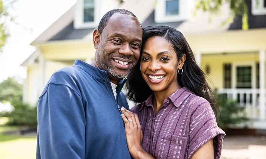 couple happy knowing what is a homeowners insurance deductible