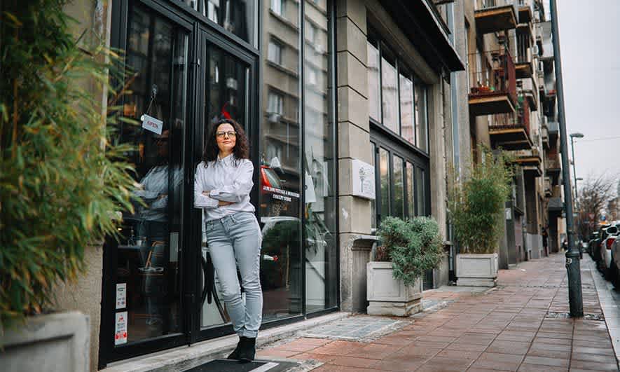 small business owner feeling happy having Lessor's Risk Only Insurance