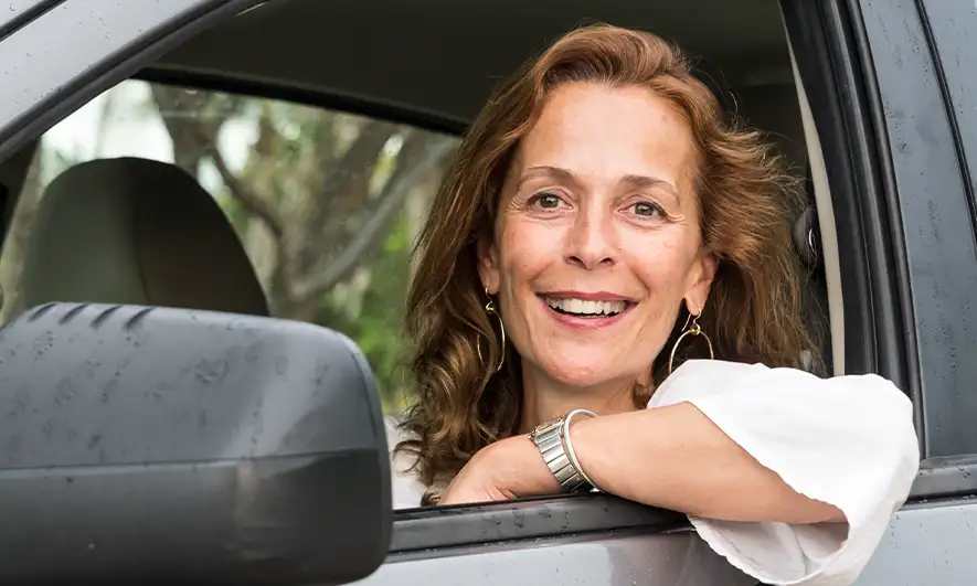 woman pleased with New Car Insurance from The Hartford