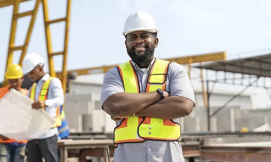 male small business owner happy to understand state compensation insurance fund