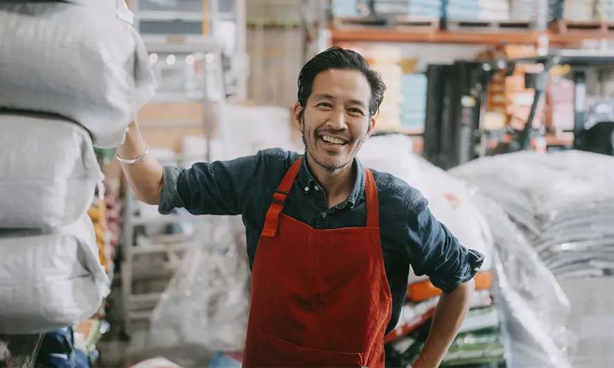 male small business owner happy to understand workers compensation class codes