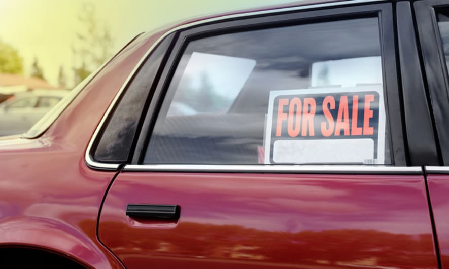 For sale sign inside a car window