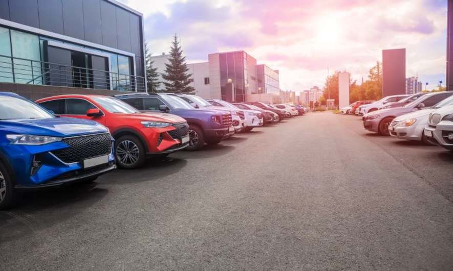 A row of cars parked outside an office