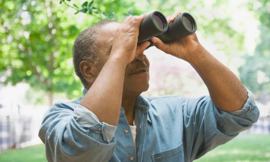Man Bird Watching During 30 Day Wellness Challenge