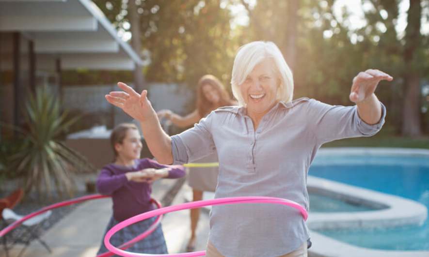 Woman Exercising With Hula Hoop For Wellness Challenge