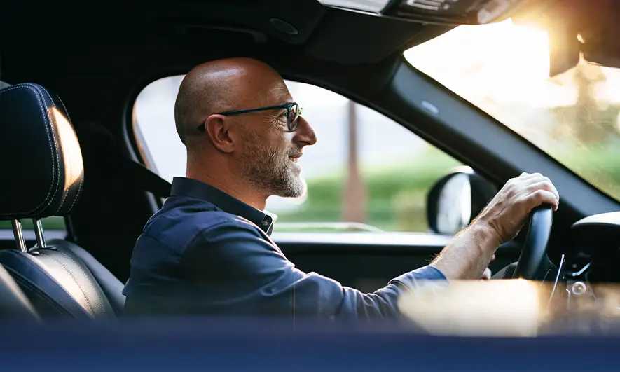 male driver happily protected by AARP Car Insurance in Illinois