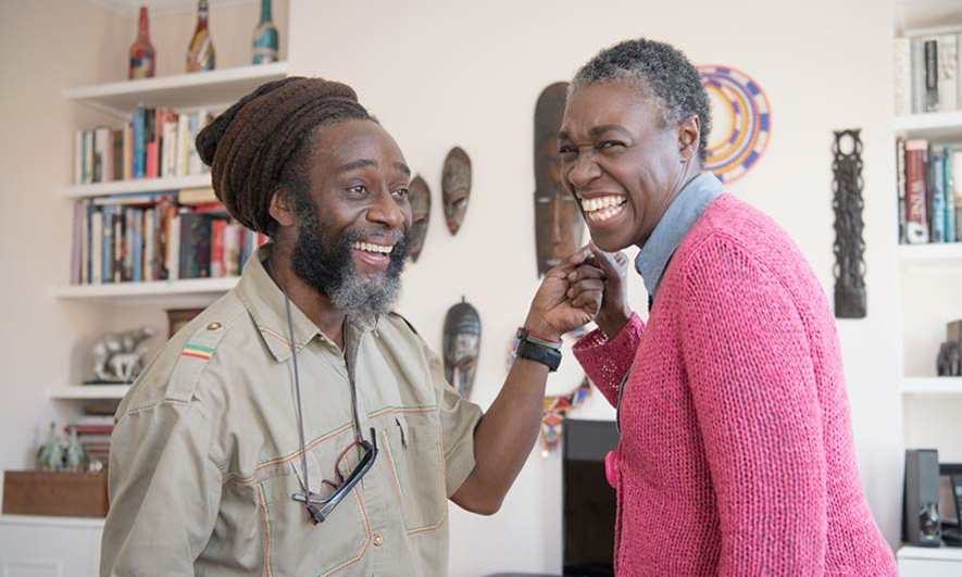 Homeowners inside their home celebrating their aarp discounts