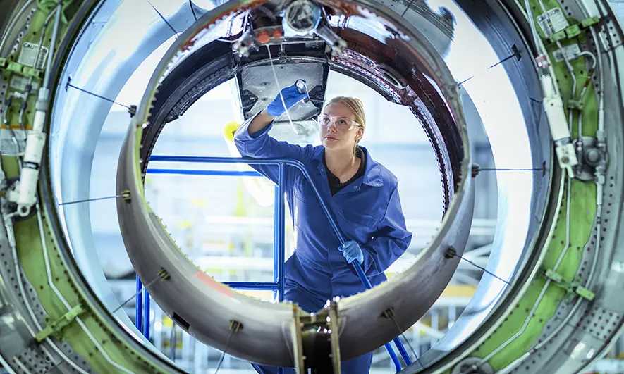 business owner happy to do her job after getting aerospace insurance quote