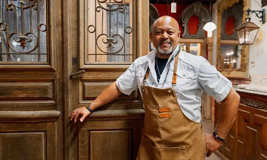 small business owner happy to get proof of antique store insurance