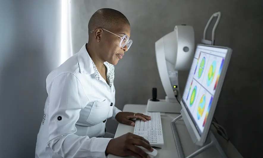 business owner happy to do her job by knowing are ophthalmologists covered by medical insurance