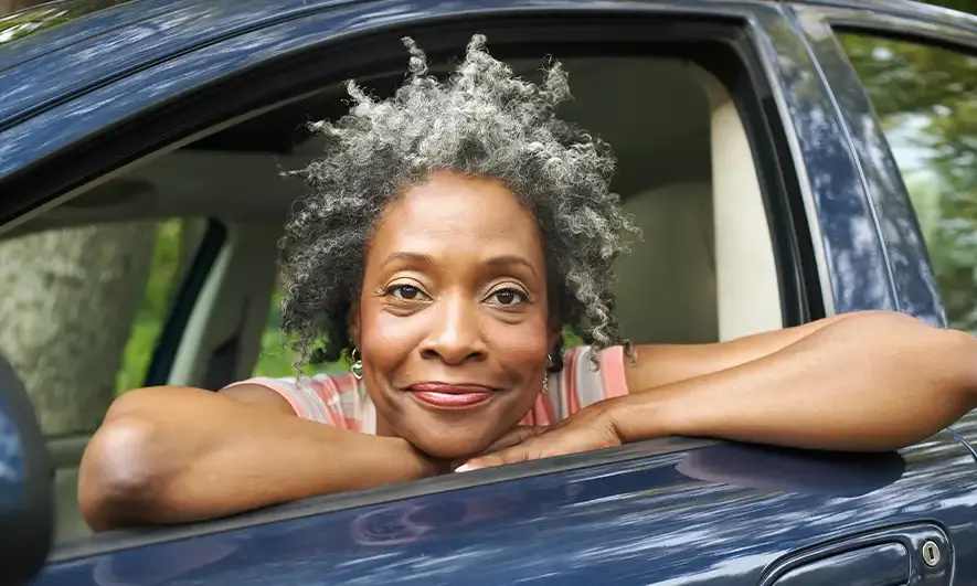 woman pleased after using The Hartford's auto insurance calculator