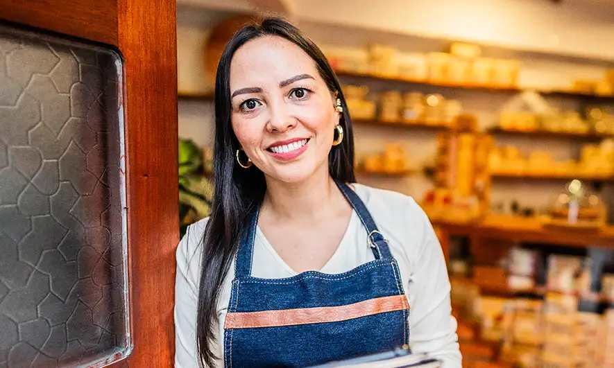 business owner happy being protected by the Best Insurance for Small Businesses 