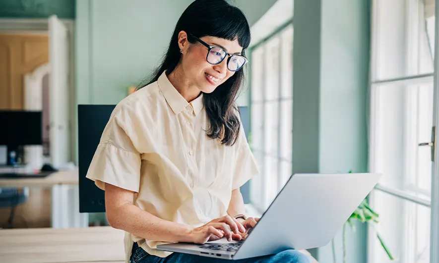 business owner happy to do her job after getting blog insurance