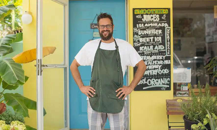 male small business owner feels secure being protected by business insurance florida