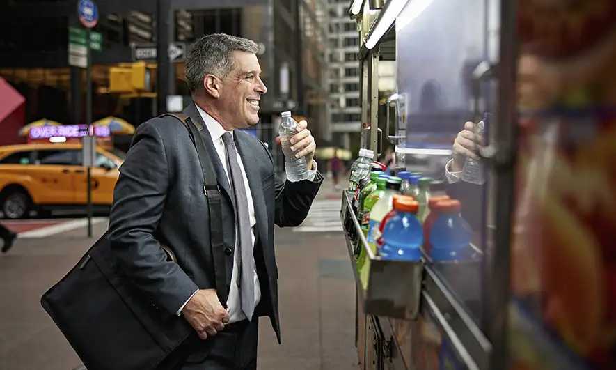 male small business owner feels secure being protected by business insurance new york