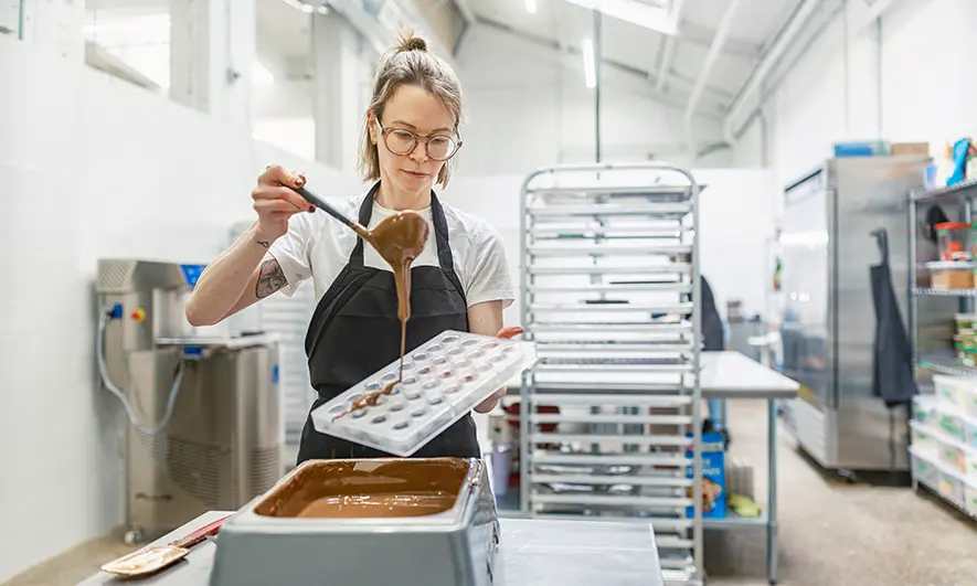 female small business owner protected by candy store insurance