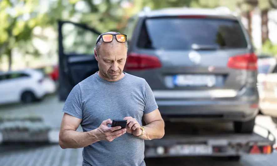 male driver submitting a car crash insurance claim