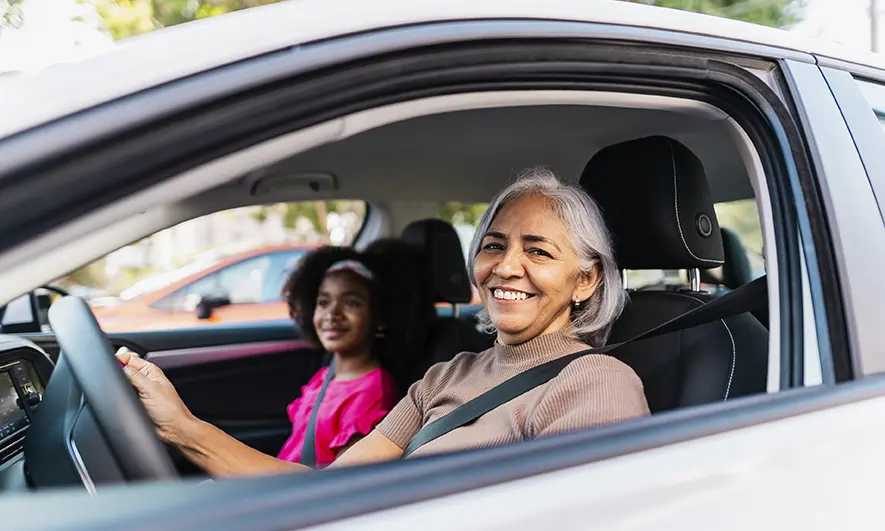 female driver protected by comprehensive and collision insurance