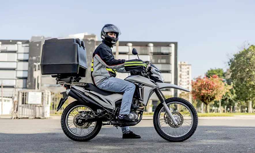 small business owner protected by courier insurance bike