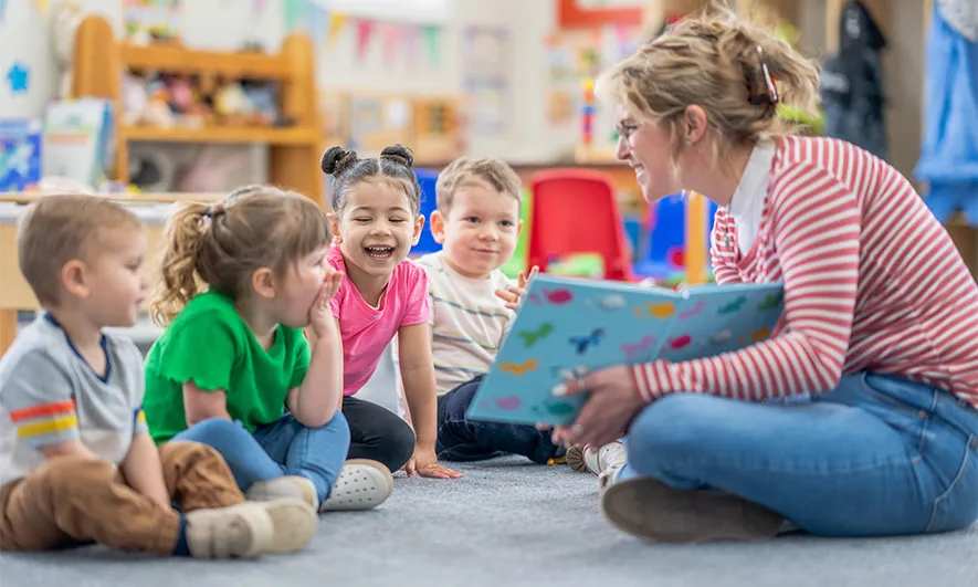 small business owner is happy after getting a daycare insurance quote from The Hartford