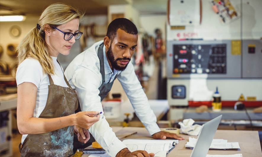 A couple reviews the e&o insurance policy for their small business