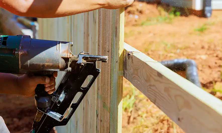 male small business owner protected by fence company insurance