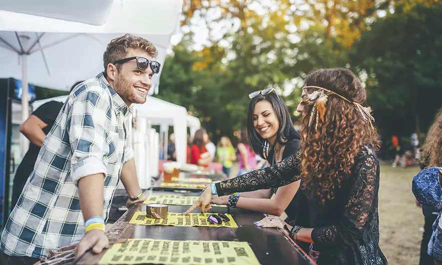 business owner happy to do his job after getting a festival insurance quote